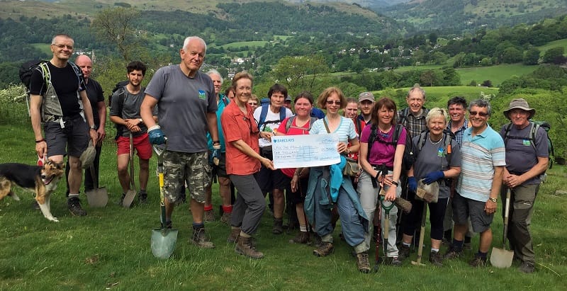 Caroline Nichol (organiser of the Charity Challenge) (right) presents the cheque for £1500 to Joanne Backshall (Fix the Fells Programme Manager) (left) with members of The Wainwright Society and volunteers from Fix the Fells (Photo © Tim Backshall)