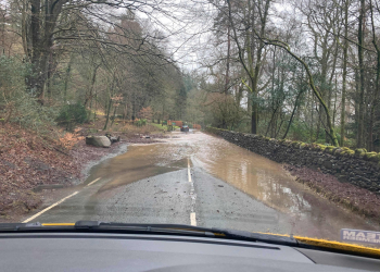 Which roads are affected by flooding in Cumbria?