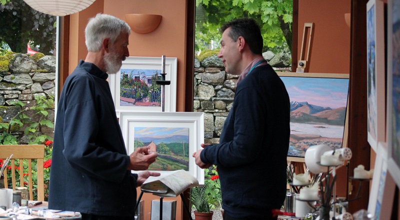 Haydn Morris discussing one of his paintings of the Eden Valley with Charlie Thornton 
