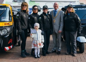Mia and the mayor wave off Beijing Biddies Tuk Tuk Challenge team