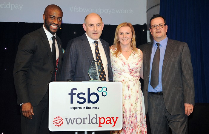 Henry and Hannah Wild (centre) with (left) awards host and entrepreneur Tim Campbell MBE who was hired by Lord Alan Sugar in the first series of The Apprentice, and James Frost, chief marketing officer of Worldpay UK.