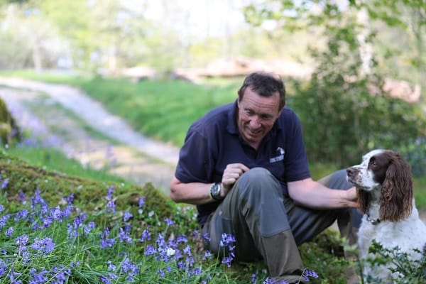 Tim Berry from English Lakes Hotels with Lily the dog and the white bluebell