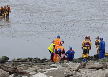 Family rescued after becoming stuck in mud