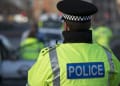 Police officer facing away from camera