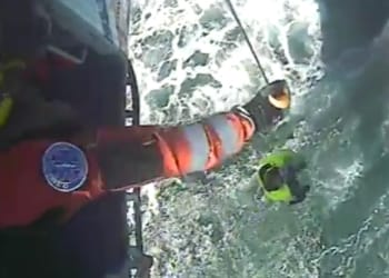 WATCH: Two men rescued from bow of their sinking capsized vessel off Walney Island