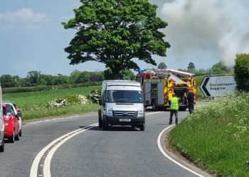 A595 blocked both ways due to van fire