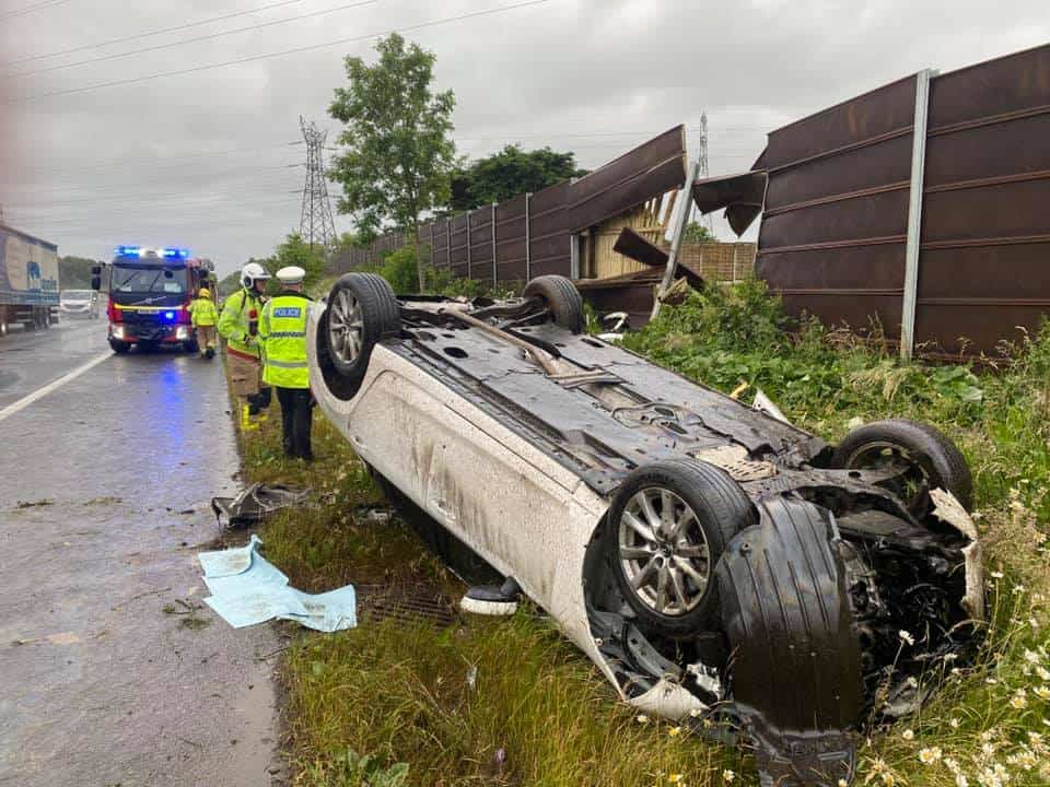 Firefighters in Carlisle have issued a warning to drivers after a car crashed into a fence and flipped onto its roof on the M6 between Carlisle and Gretna. 