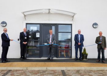 Copeland Mayor Mike Starkie cuts the ribbon at Iron Mountain’s new Whitehaven office