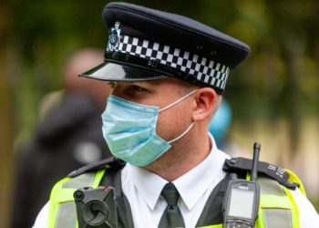 Policeman wearing facemask during coronavirus