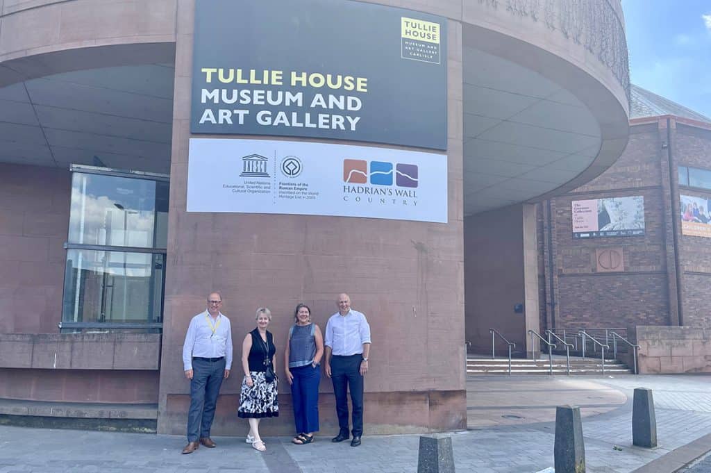Tullie House is celebrating after it becomes the first organisation along Hadrian's Wall to be decorated with the UNESCO World Heritage emblem.