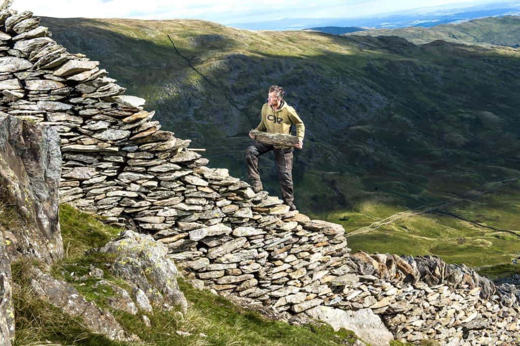 David Birkett, rock climber and stonemason: David is in his element when he's in the fells rebuilding dry stone walls, such as this stretch on High Pike, part of the Fairfield Horseshoe above Ambleside. September 2013