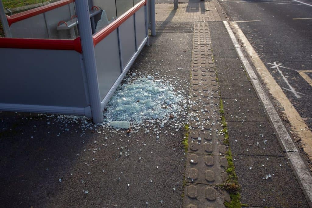 glass smashed in bus shelter