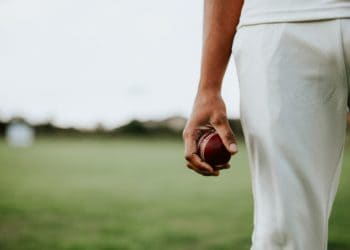Cricket bowler holding cricket ball