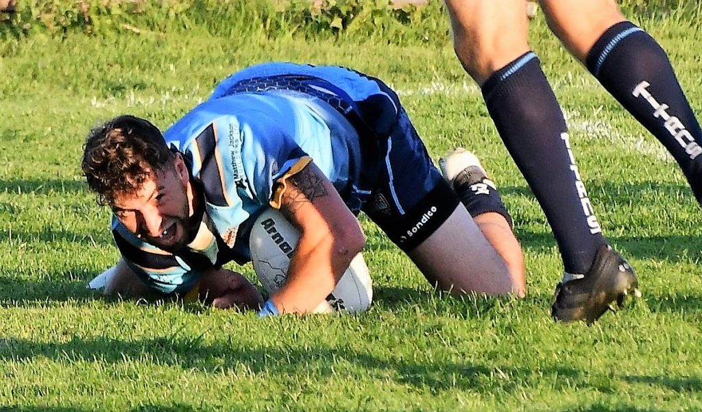 Cockermouth's Jack Clark scores his second try. Picture: Ben Challis