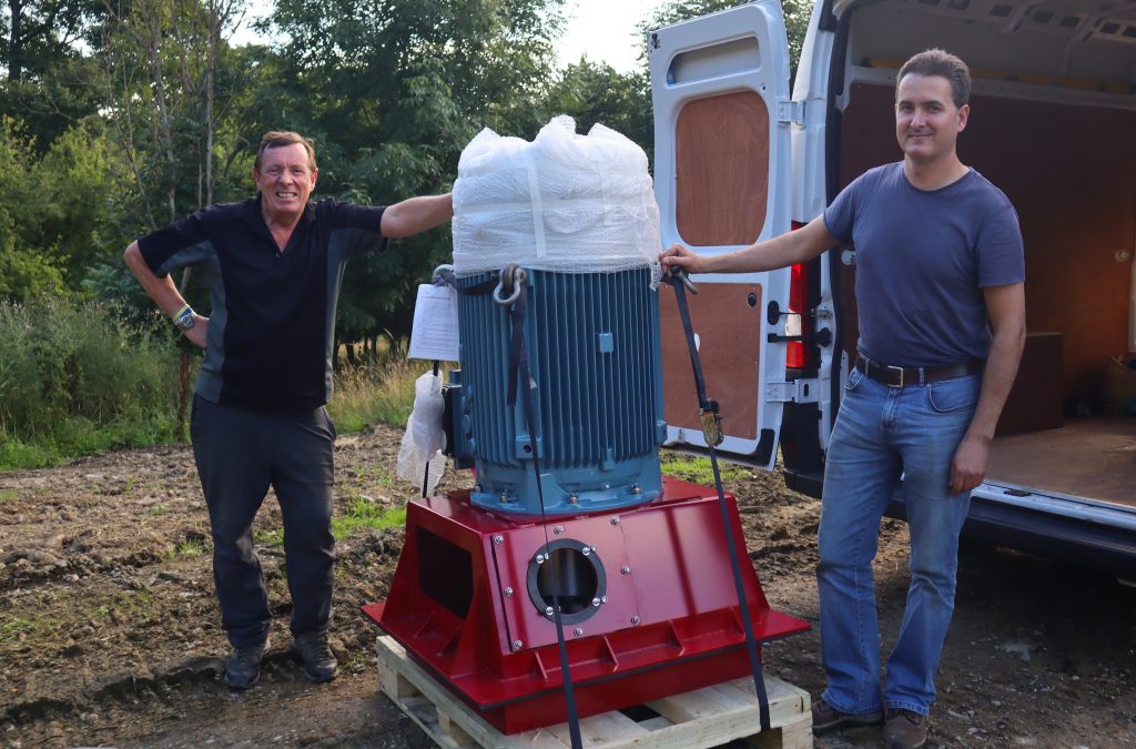 Tim Berry (left) from English Lakes Hotels and Roberto Sotgiu from Hydrolite with the turbine 