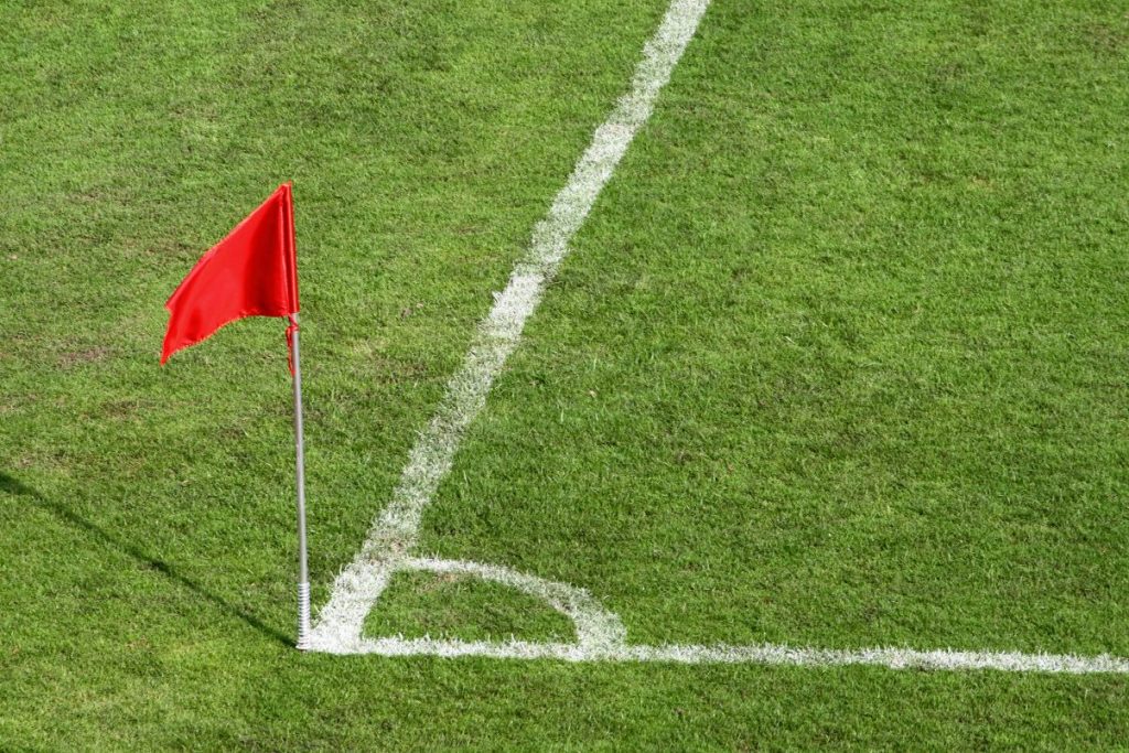 A football corner flag and corner of the pitch