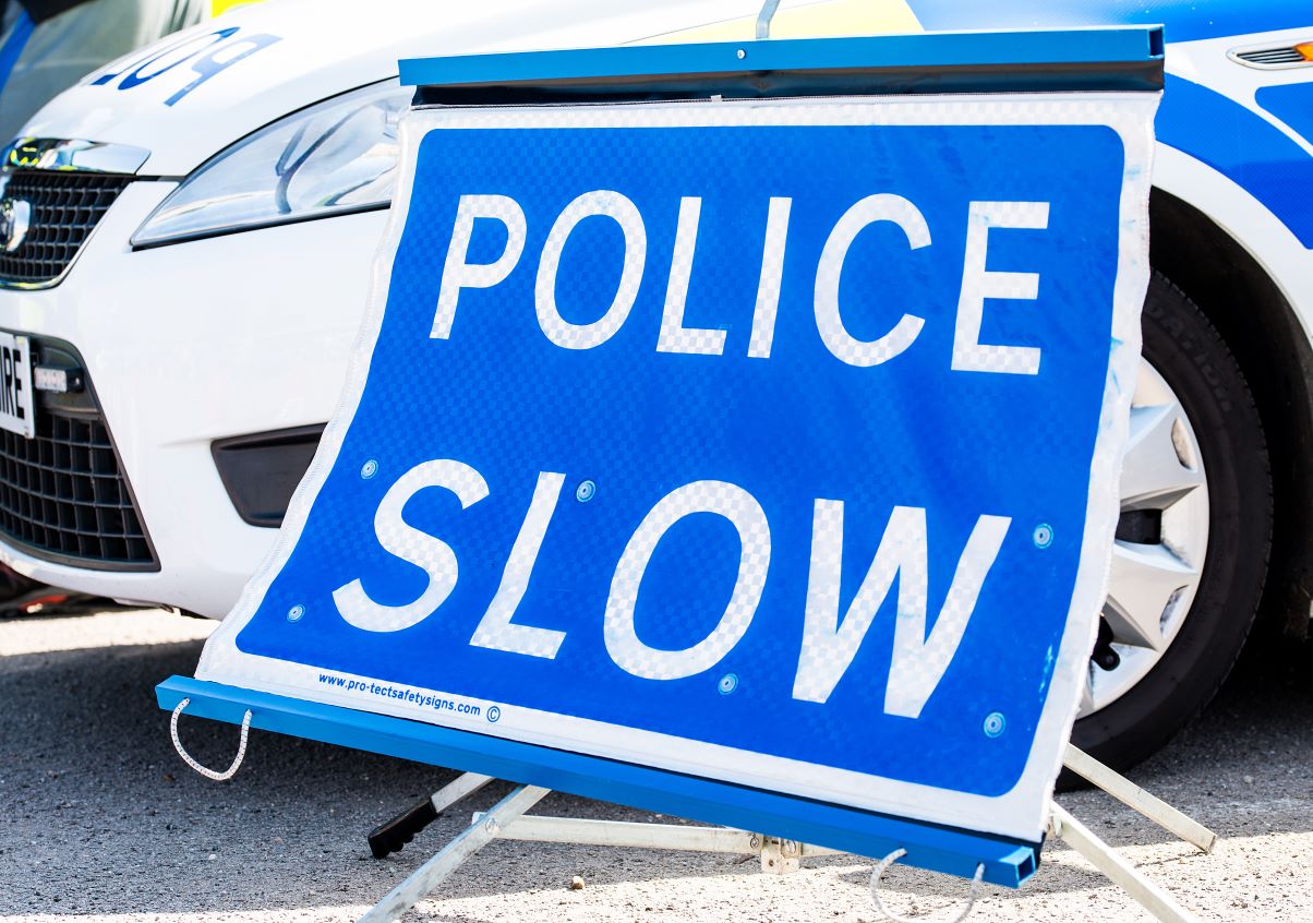 police slow sign