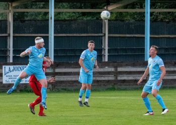 Bandaged Jack Brannan heads clear for Carlisle City against Tow Law