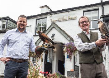 Adam Bujok (left) from the Wild Boar Inn with Harris Hawk Popeye and Stephen Lea from Lake District Falconry with Peregrine Falcon Dot