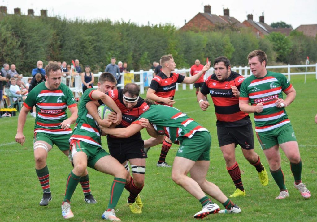Phil Dixon battles his way through against West Hartlepool