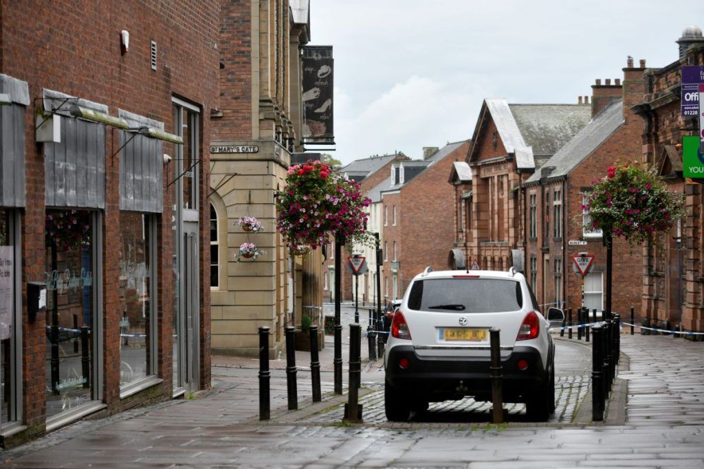 Detectives investigating a suspected murder in Carlisle say they are still looking for other individuals despite making four arrests.