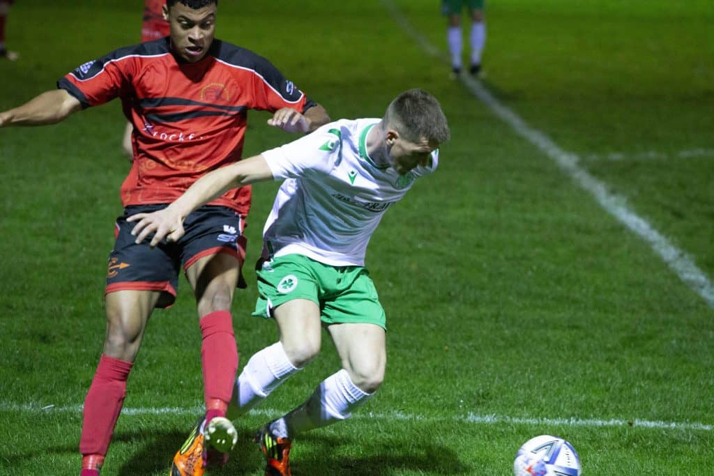 Brad Tatton battles to win the ball for Celtic.