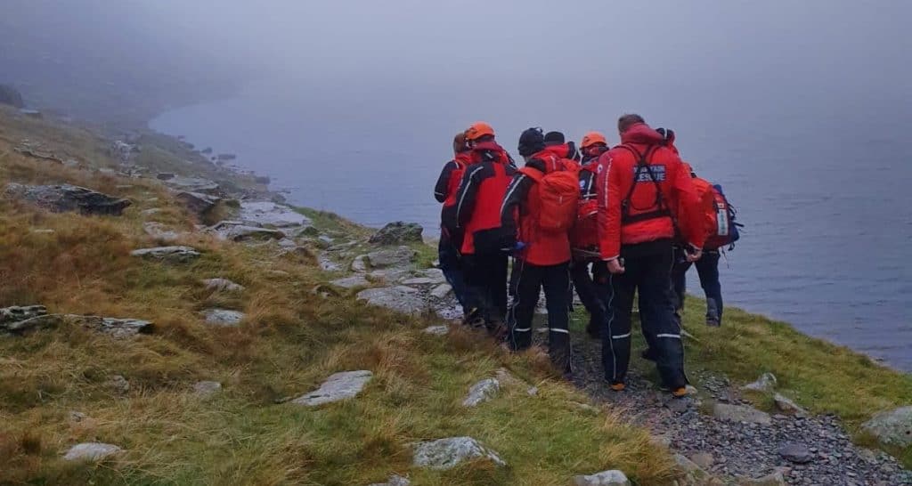 Eleven mountain rescue team members were called to rescue a man who fell and dislocated his knee. 
