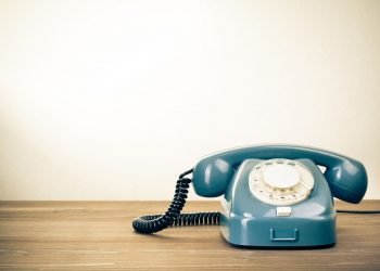 blue telephone on a table