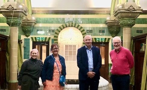 A family connection has been revealed which links the chairwoman of a campaign group to the baths which she supports.