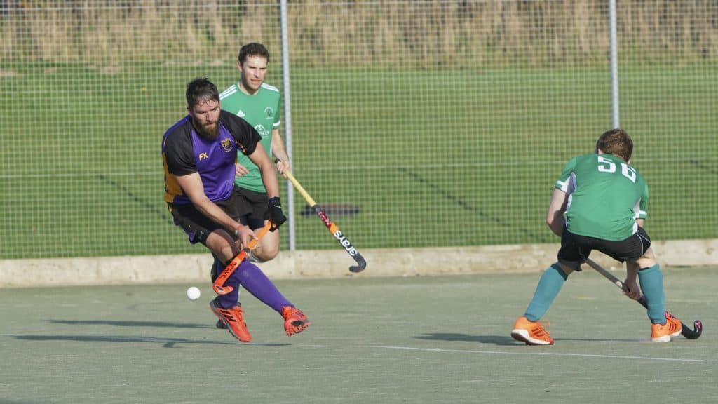 Tom Morgan (purple, left) leaves the Didsbury defender wrong-footed. Picture: Pete Bratley