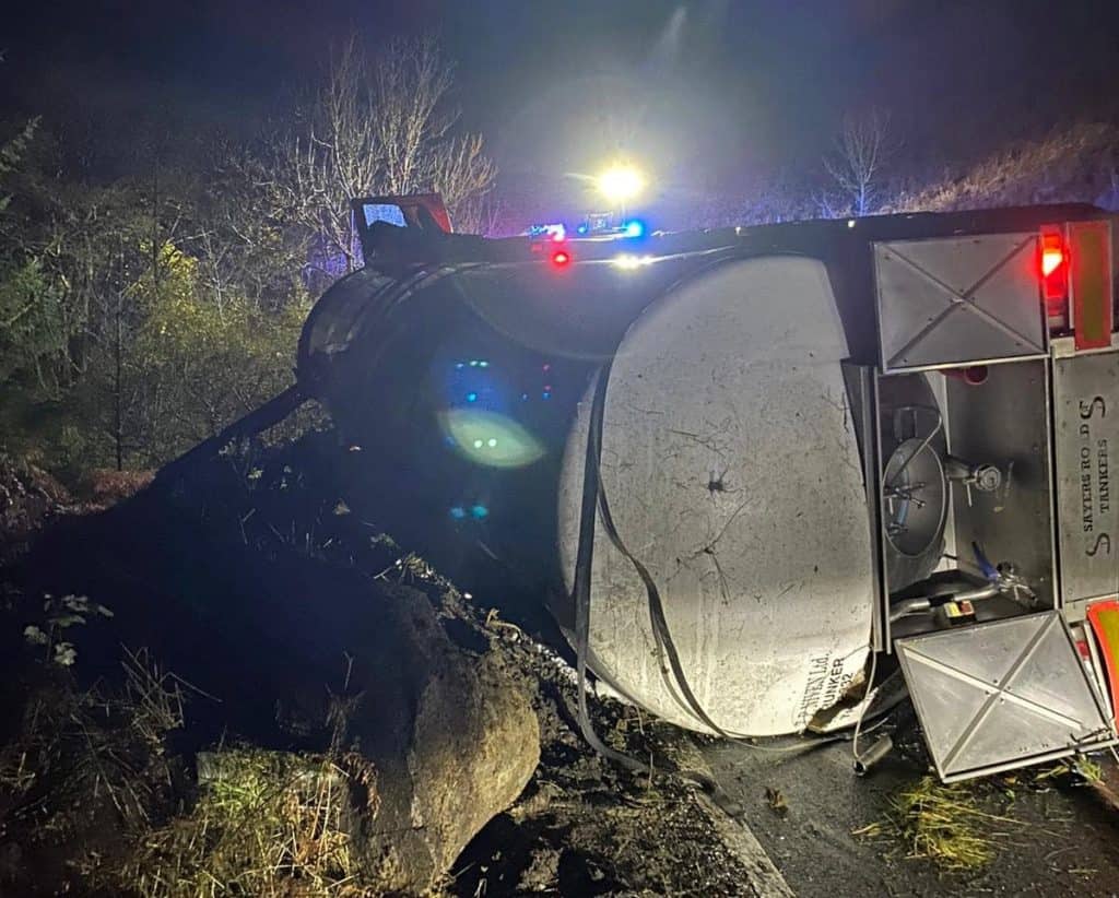 Firefighters were called to an overturned milk tanker on the A7.