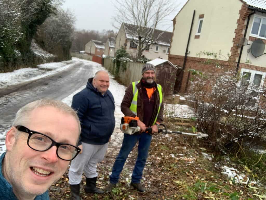 Councillor Gareth Ellis (left) with the landlord's agent and a resident