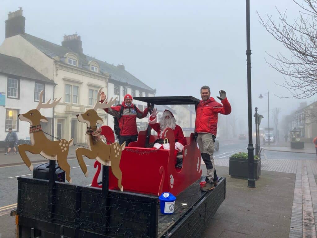 Santa helps the Wasdale Mountain Rescue Team raise over £2,000 during a flag day appeal. Here is Santa pictured with mountain rescue volunteers