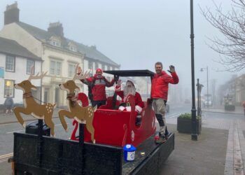 Santa helps the Wasdale Mountain Rescue Team raise over £2,000 during a flag day appeal. Here is Santa pictured with mountain rescue volunteers