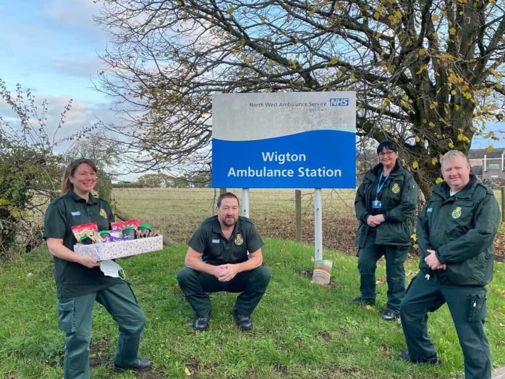 Staff at the North West Ambulance Service receive a hamper from Dood & Co