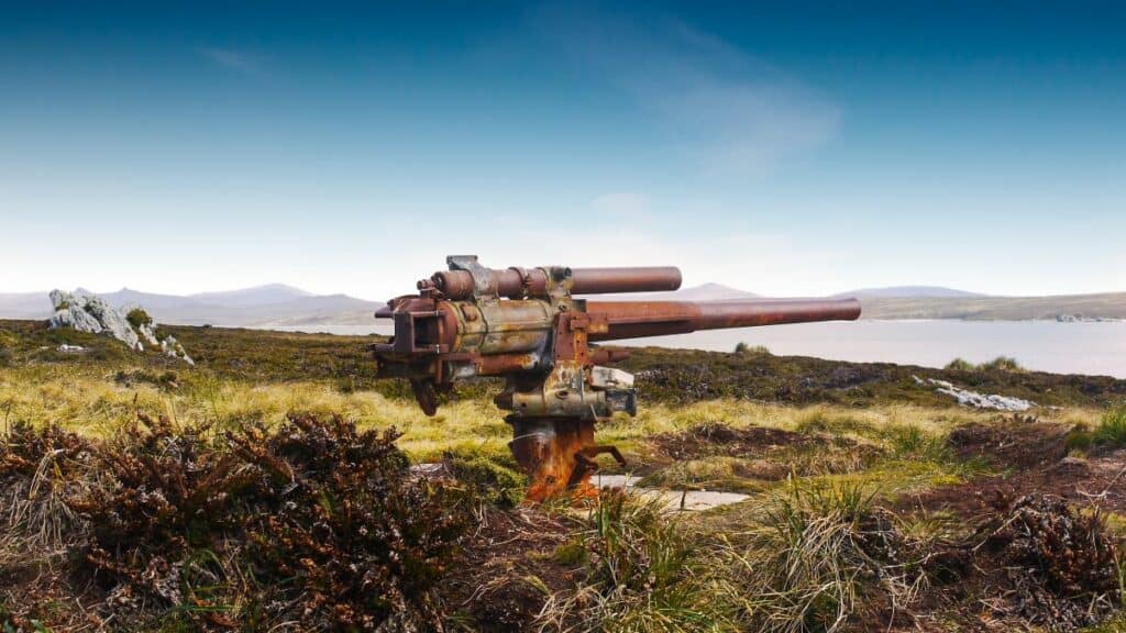 Rusting world war 2 naval mounted gun relic at Ordnance Point on a minefield from Falklands War on East Falkland Island, Falkland Islands