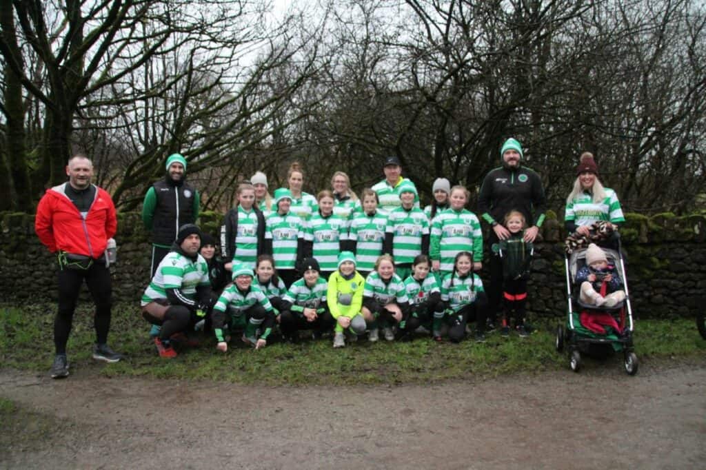 Cleator Moor Celtic's girls under-12s squad joins Gary McKee in his challenge. Picture: Elwyn Evans