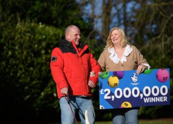 Ian Black, 61, and Sandra Black, 55, celebrate winning £2 million on a Monopoly Deluxe Scratchcard with their dog Meg, near Carlisle, northern England on Januray 20, 2022. The couple say paying for an operation for their rescued dog, Meg, a cross Labrador/Staff is now top of the shopping list. Ian and Sandra have five children and 10 grandchildren who are all currently living in rented accommodation. Helping their children to get on to the property ladder is also among their plans.