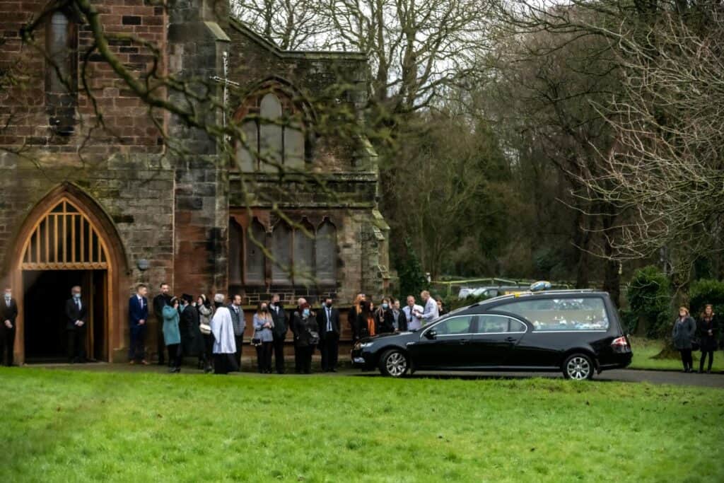 Mourners gather for the funeral of Natalie and Harry Kane