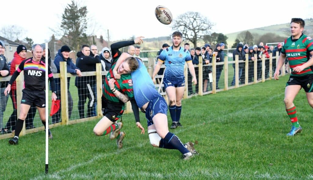 The Titan's Rob Scott makes a try-line tackle. Picture: Ben Challis