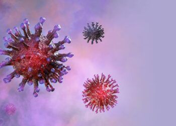 Three red models of the coronavirus set against a pink smoked background. All three are differing sizes