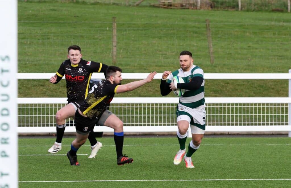 Ben Brookes on his debut for the 1st's cuts back inside the full-back to score the first of his two tries. Picture: David Nattrass