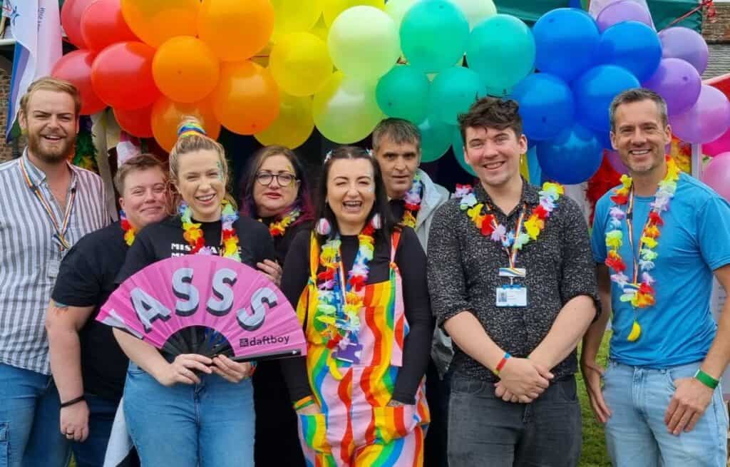 CNTW LGBT Staff Network at Cumbria Pride, pictured with a range of colourful balloons behind them