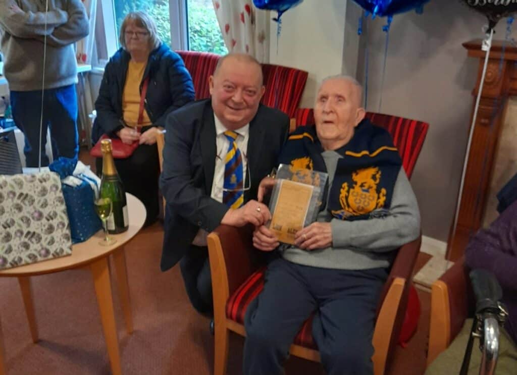 Former Haven chairman Tom Todd with long-serving supporter Ernie Rothery who was celebrating his 100th birthday