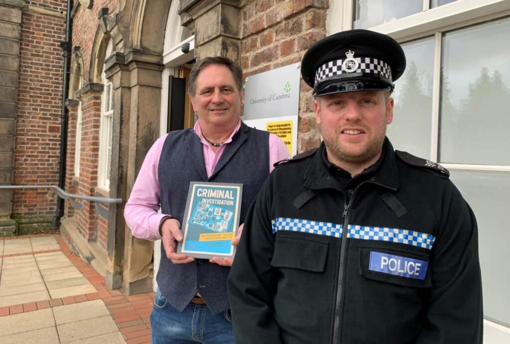 University of Cumbria policing and security lecturer Iain Stainton and one of his former students Dr Rob Ewin have written Criminal Investigation, a new book for policing and criminology students, pictured at the Fusehill Street campus in Carlisle. Rob is pictured holding a copy of the book