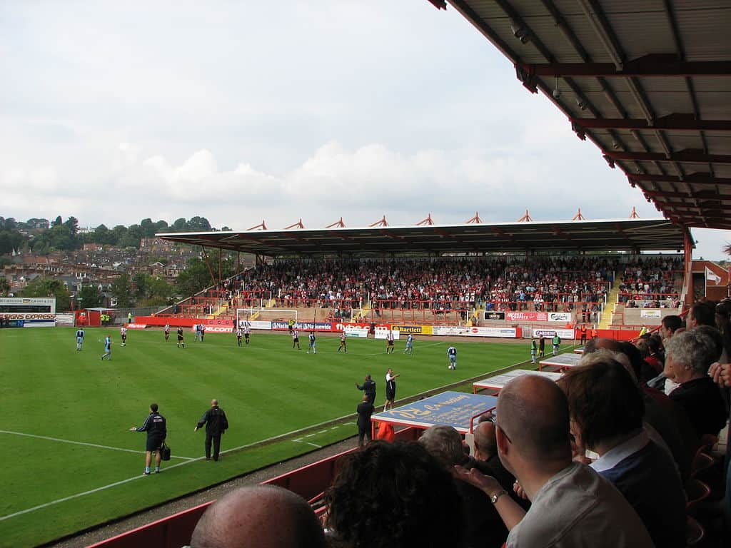 St James' Park football stadium in Exeter, Devon. The picture shows a view of the pitch from the stand during a game