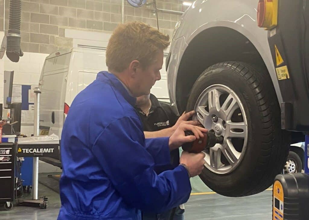 Furness College Professor Andrew Wren took on Simon Fell MP in a tyre change challenge against the clock