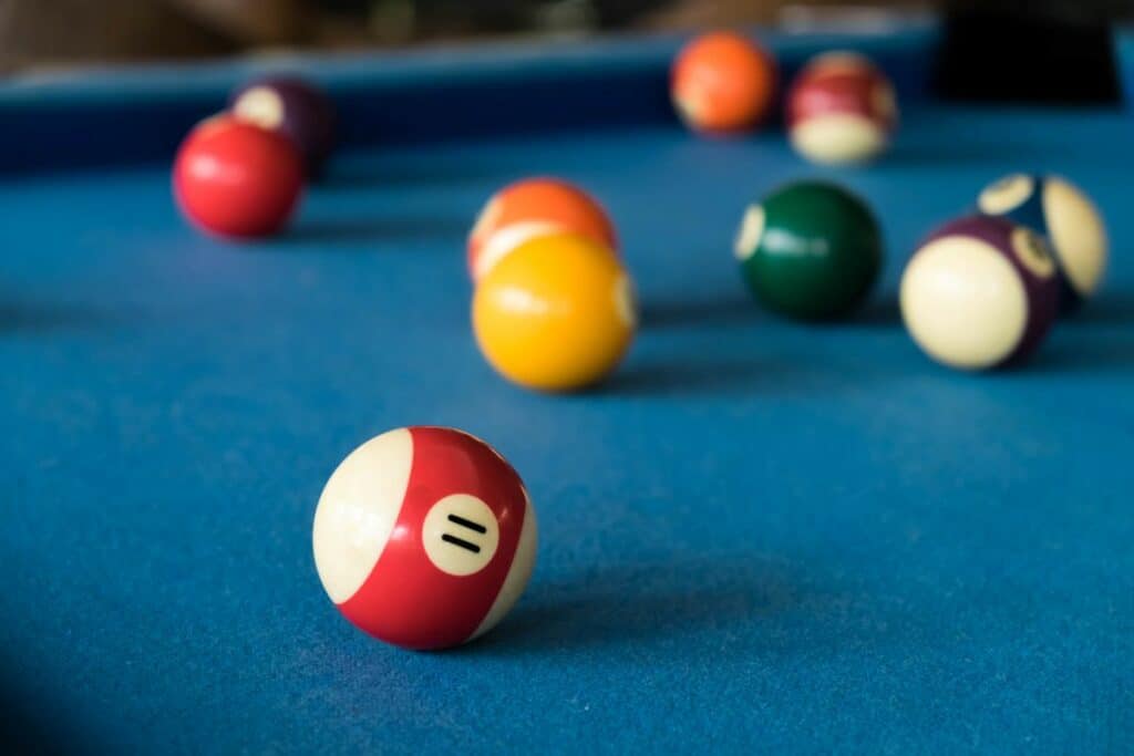 pool balls on a blue pool table