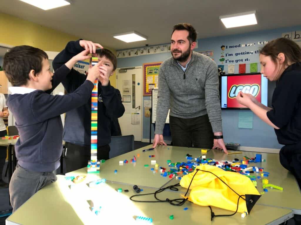 Primary Business Partnership working in a school in West Cumbria. Children play with Lego as part of the programme
