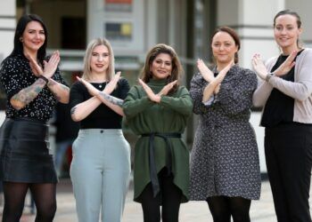 Avanti West Coast International Women's Day control team. (L-R): Amy Bellamy, Liane McMahon, Nitu Kapila, Rachel Hartill, Lisa Healy. They all poses with hands making a cross an X shape
